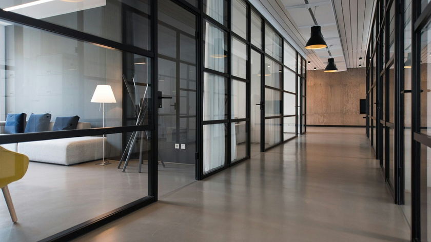 Modern commercial office interior with glass partitions